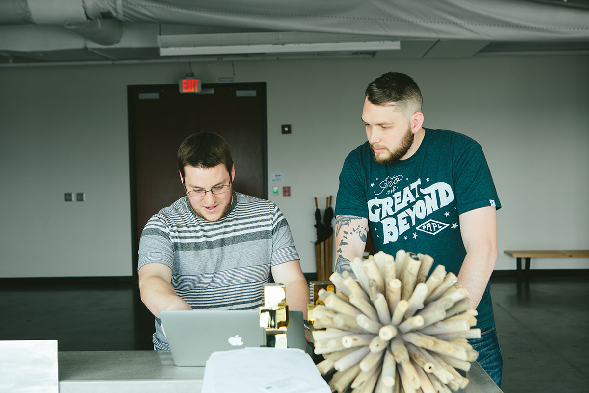 two men on a computer