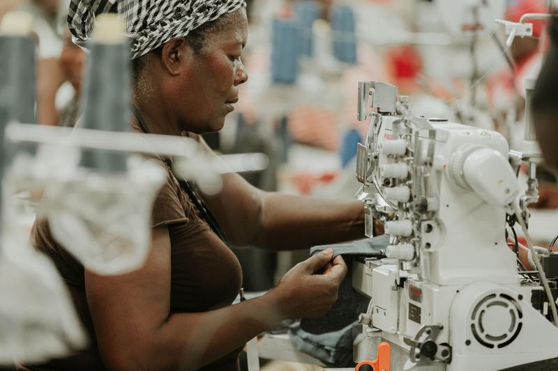 woman using sewing machine