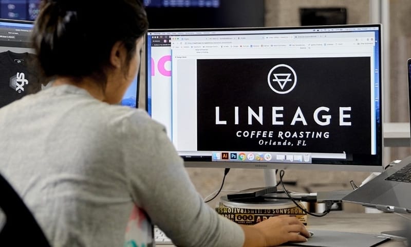 An artist works on creating a high-res mockup of a customer's custom design. 