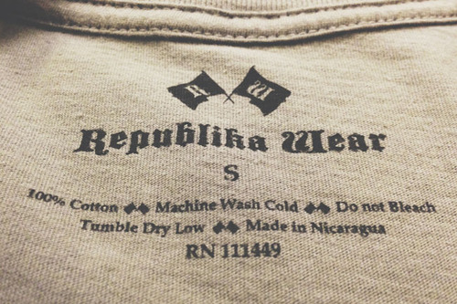 tan shirt with black tag print