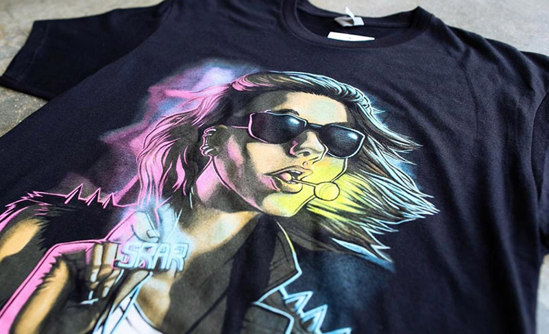 black shirt with colorful graphic of woman on it