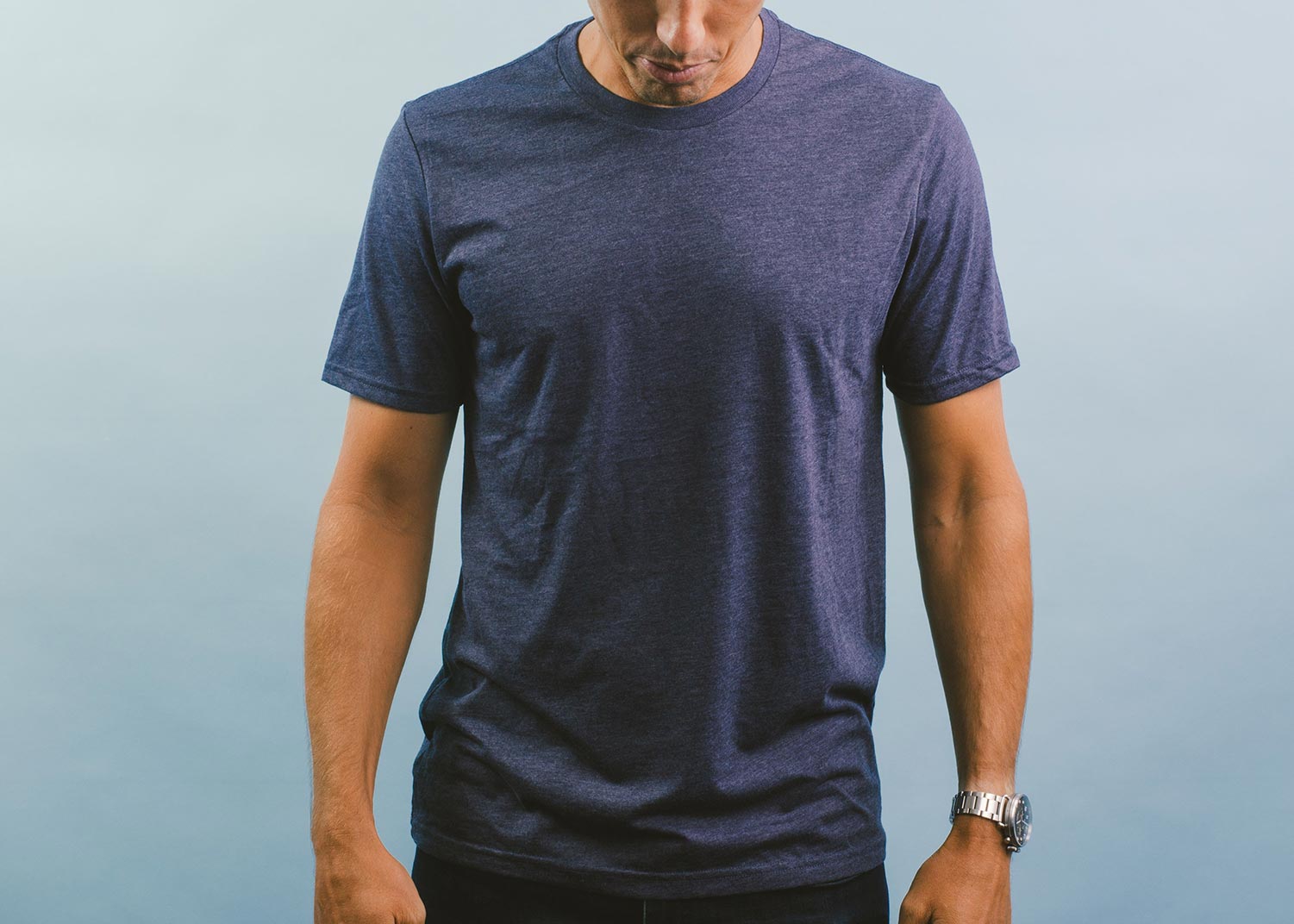 man standing with navy shirt