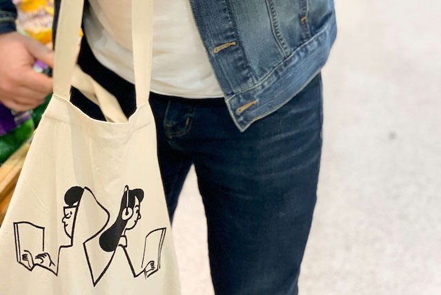 Man shopping with custom reusable shopping bag