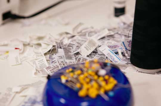 pile of torn off tags and pins