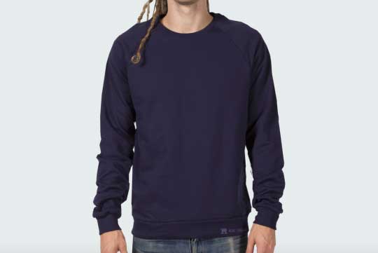 man with long hair with navy sweater