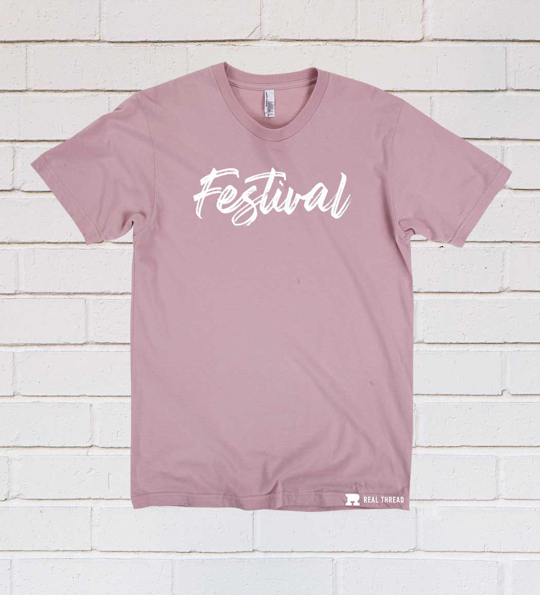pink shirt with white text on front