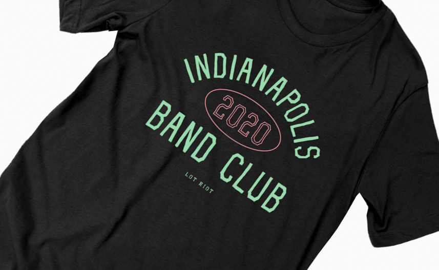 Black t-shirt with light green and pink text on a white background