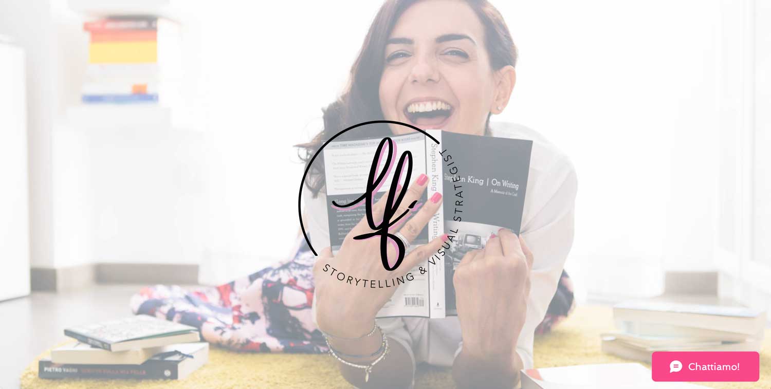 Linda Franzosi laughing holding a book