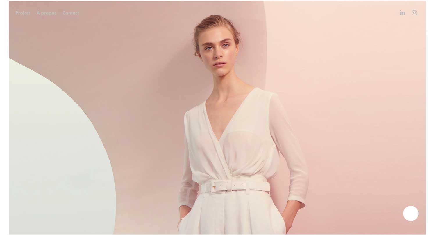 woman standing in front of pink wall