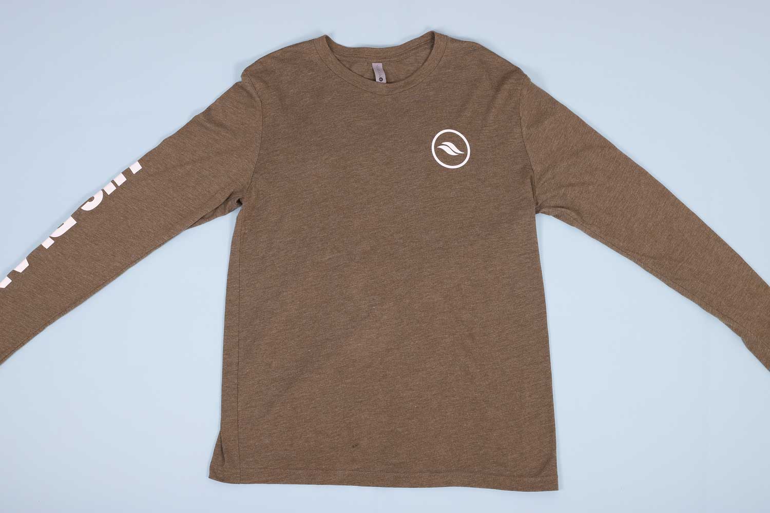 Olive long sleeve t-shirt laying out flat on a light blue background