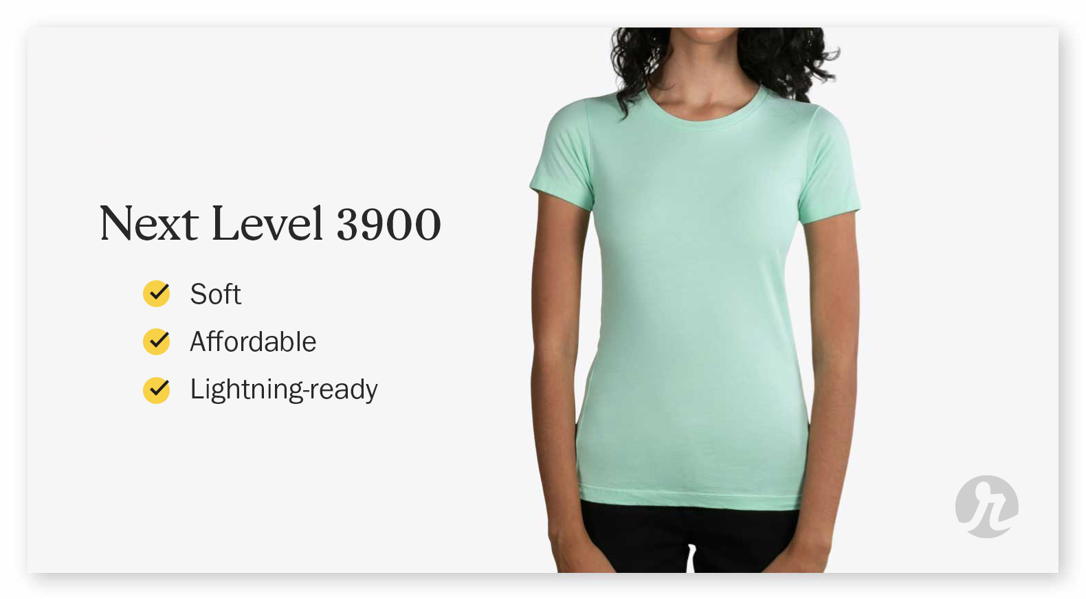 A woman wearing a light green Next Level 3900 shirt